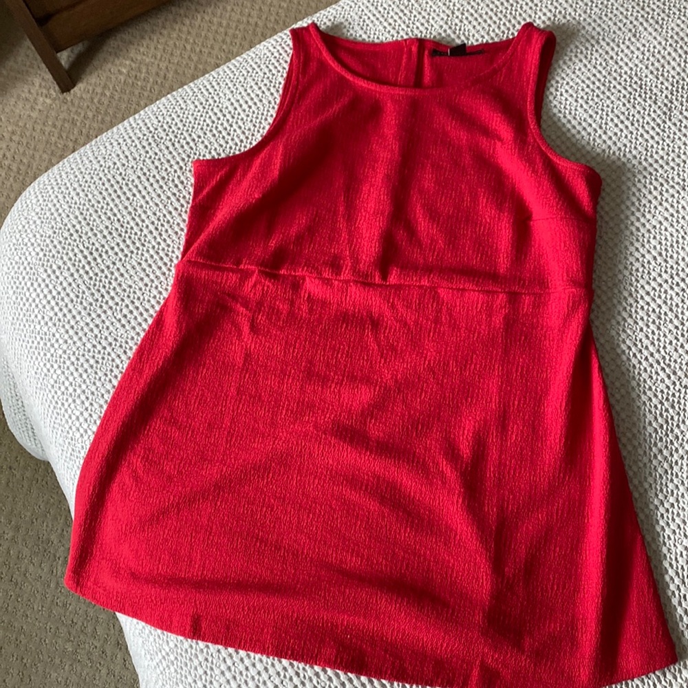 Never worn beautiful red crepe-like top with loose empire maternity hem